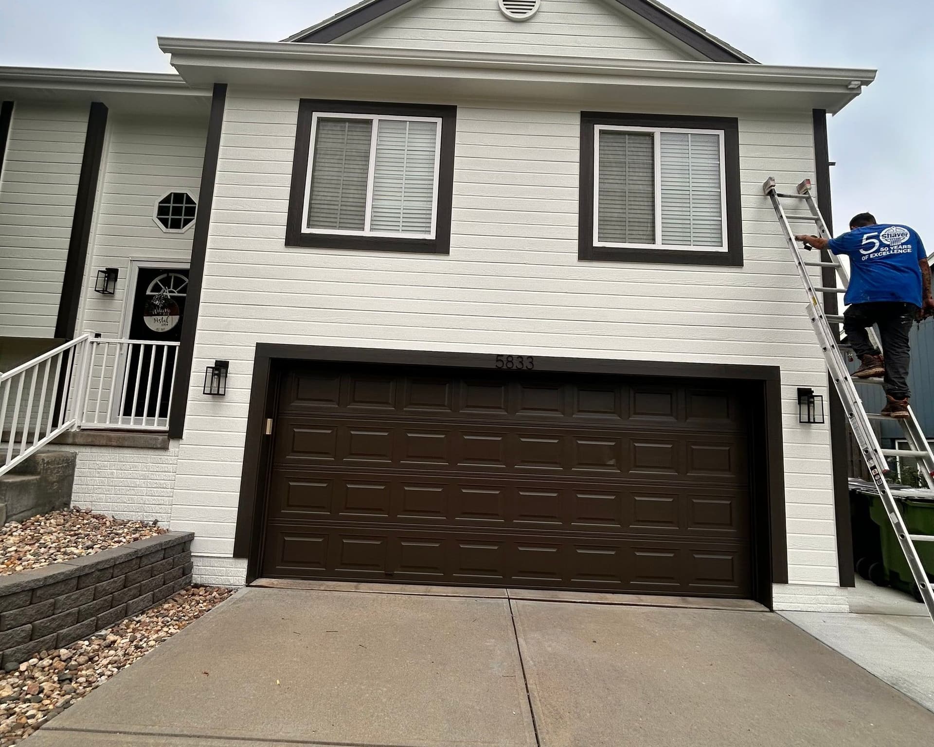 D&M Construction & Exteriors crew working on a home exterior in Omaha, Nebraska